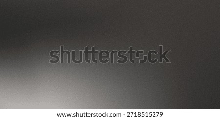 Black matte textured background with floating dust particles illuminated by soft light in the top right corner, creating a deep contrast between black and white.