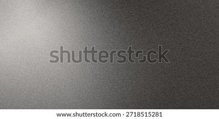 Black matte textured background with floating dust particles illuminated by soft light in the top right corner, creating a deep contrast between black and white.
