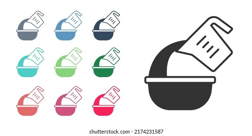 Black Measuring cup pouring liquid into bowl icon isolated on white background. Plastic graduated beaker with handle. Set icons colorful. Vector