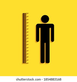 Black Measuring height body icon isolated on yellow background. Long shadow style. Vector.