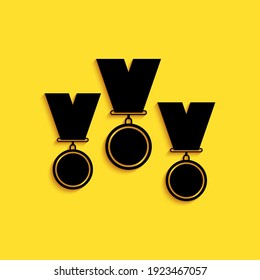 Black Medal set icon isolated on yellow background. Winner simbol. Long shadow style. Vector