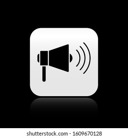 Black Megaphone icon isolated on black background. Loud speach alert concept. Bullhorn for Mouthpiece scream promotion. Silver square button. Vector Illustration