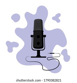Black microphone with a cord on the background of an abstract pattern.