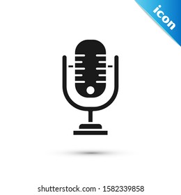 Black Microphone icon isolated on white background. On air radio mic microphone. Speaker sign.  Vector Illustration