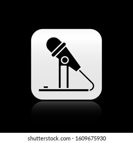 Black Microphone icon isolated on black background. On air radio mic microphone. Speaker sign. Silver square button. Vector Illustration