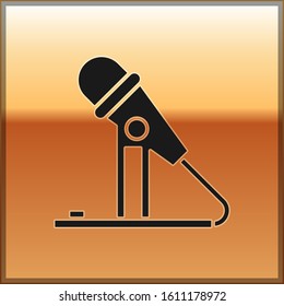 Black Microphone icon isolated on gold background. On air radio mic microphone. Speaker sign.  Vector Illustration