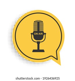 Black Microphone icon isolated on white background. On air radio mic microphone. Speaker sign. Yellow speech bubble symbol. Vector