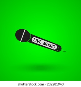 black microphone on a green background