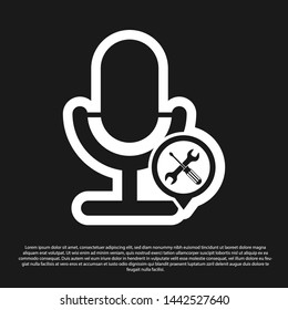 Black Microphone with screwdriver and wrench icon isolated on black background. Adjusting, service, setting, maintenance, repair, fixing.  Vector Illustration