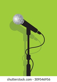 a black microphone stand on a green background