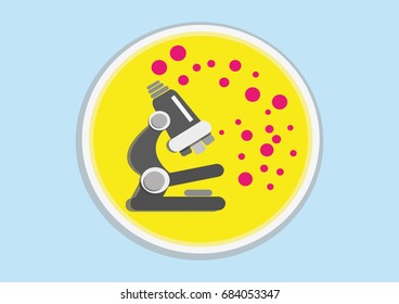 Black Microscope On Yellow Agar Plate.