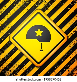 Black Military helmet icon isolated on yellow background. Army hat symbol of defense and protect. Protective hat. Warning sign. Vector Illustration