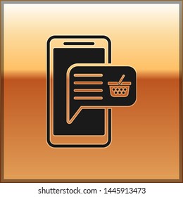 Black Mobile phone and shopping basket icon isolated on gold background. Online buying symbol. Supermarket basket symbol. Vector Illustration