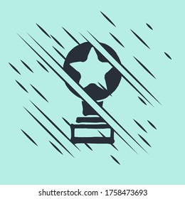 Black Movie trophy icon isolated on green background. Academy award icon. Films and cinema symbol. Glitch style. Vector Illustration