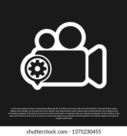 Black Movie or Video camera and gear icon isolated on black background. Adjusting app, service concept, setting options, maintenance, repair, fixing. Vector Illustration