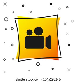 Black Movie or Video camera icon isolated on white background. Cinema camera icon. Yellow square button. Vector Illustration