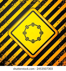 Black Musical instrument percussion tambourine, with metal plates icon isolated on yellow background. Warning sign. Vector