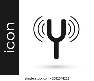 Black Musical tuning fork for tuning musical instruments icon isolated on white background.  Vector