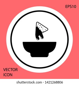 Black Nachos in plate icon isolated on red background. Tortilla chips or nachos tortillas. Traditional mexican fast food. White circle button. Vector Illustration