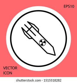 Black Nuclear rocket icon isolated on red background. Rocket bomb flies down. White circle button. Vector Illustration