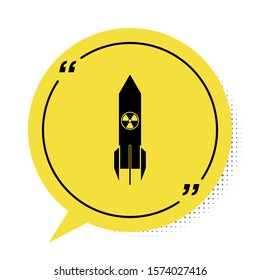 Black Nuclear rocket icon isolated on white background. Rocket bomb flies down. Yellow speech bubble symbol. Vector Illustration