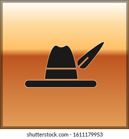 Black Oktoberfest hat icon isolated on gold background. Hunter hat with feather. German hat.  Vector Illustration