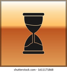 Black Old hourglass with flowing sand icon isolated on gold background. Sand clock sign. Business and time management concept.  Vector Illustration