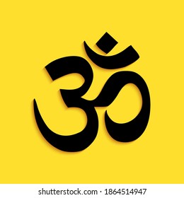 Black Om or Aum Indian sacred sound icon isolated on yellow background. The symbol of the divine triad of Brahma, Vishnu and Shiva. Long shadow style. Vector.