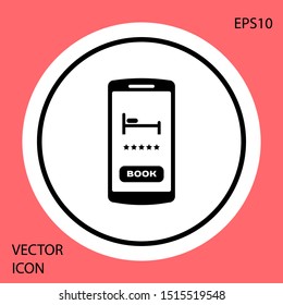 Black Online hotel booking icon isolated on red background. Online booking design concept for mobile phone. White circle button. Vector Illustration