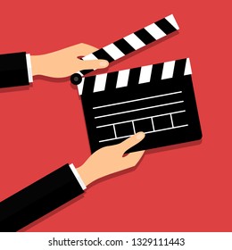 Black opened clapperboard in hands. Movie production clapper board. Cinematography concept. Vector illustration in modern flat style. EPS 10.