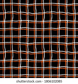Black and orange scottish cell. Seamless hand-drawn pattern. Vector illustration.