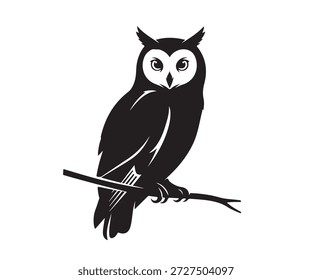 A black owl perching calmly on a tree branch.