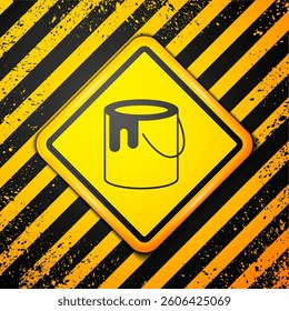 Black Paint bucket icon isolated on yellow background. Warning sign. Vector