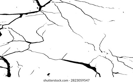 Black paint dripping down a fractured white concrete surface. 