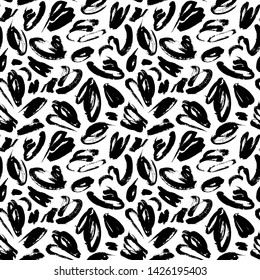 Black paint smears hand drawn seamless pattern. Brushstroke blots, chaotic specks vector illustration. Chaotic stains decorative texture. Trendy ink pen daub backdrop. Wallpaper, wrapping paper design