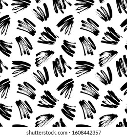 Black painted brush strokes seamless vector pattern. Black brushstrokes on a white background. Scribble smears wallpaper, wrapping paper, fabric. Modern ink illustration. Abstract rough texture. 