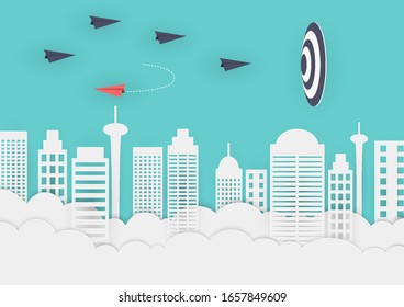 The black paper plane flew into the target while the red paper plane turned over.
