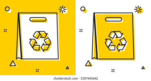 Black Paper shopping bag with recycle icon isolated on yellow and white background. Bag with recycling symbol. Random dynamic shapes. Vector Illustration