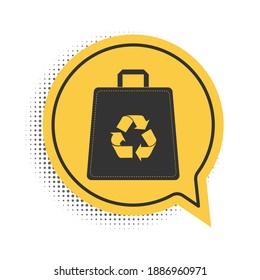 Black Paper shopping bag with recycle icon isolated on white background. Bag with recycling symbol. Yellow speech bubble symbol. Vector.
