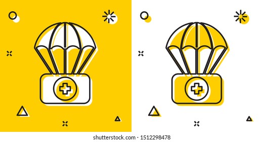 Black Parachute with first aid kit icon isolated on yellow and white background. Medical insurance. Random dynamic shapes. Vector Illustration