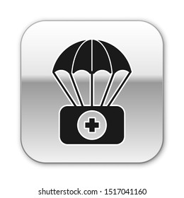 Black Parachute with first aid kit icon isolated on white background. Medical insurance. Silver square button. Vector Illustration