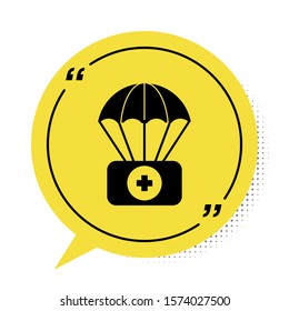 Black Parachute with first aid kit icon isolated on white background. Medical insurance. Yellow speech bubble symbol. Vector Illustration