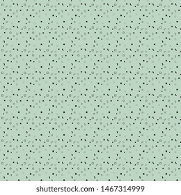 
Black pattern of squares, circles, balls, curve scattered randomly on a soft green background. Vector illustration for textile, surface packaging, packaging design.