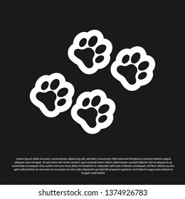 Black Paw print icon isolated on black background. Dog or cat paw print. Animal track. Vector Illustration