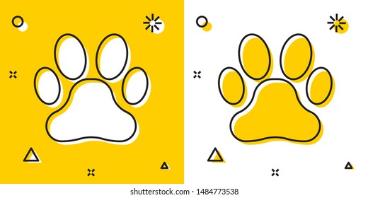 Black Paw print icon isolated on yellow and white background. Dog or cat paw print. Animal track. Random dynamic shapes. Vector Illustration