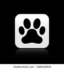 Black Paw print icon isolated on black background. Dog or cat paw print. Animal track. Silver square button. Vector Illustration