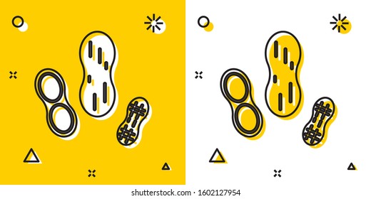 Black Peanut icon isolated on yellow and white background. Random dynamic shapes. Vector Illustration