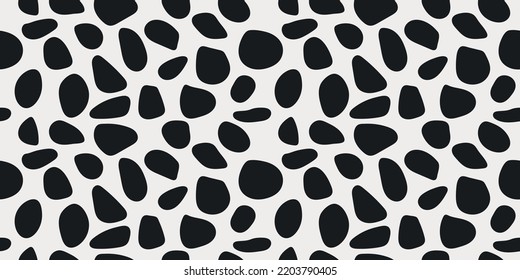 Black pebbles are scattered across the canvas. Vector from shapeless rounded shapes. For print and interior.
