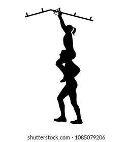 Black people's silhouettes. Athletic man helps woman on his shoulders to overcome the obstacle. Team racing. Obstacle course symbol.  Vector illustration.