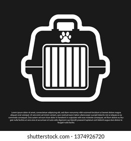 Black Pet carry case icon isolated on black background. Carrier for animals, dog and cat. Container for animals. Animal transport box. Vector Illustration